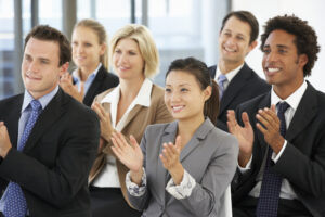 Group Of Business People Applauding Speaker At The End Of A Presentation.